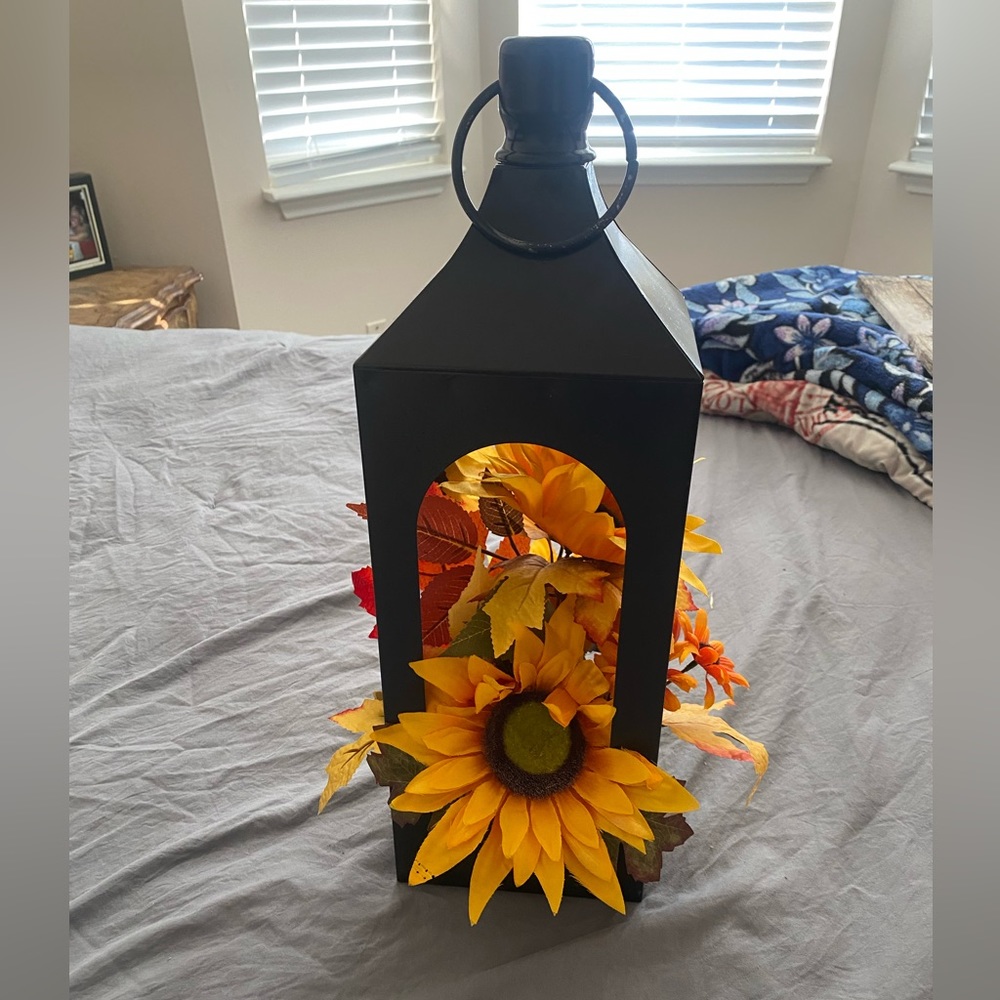 Lantern with faux sunflowers
